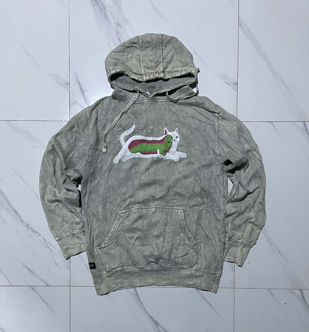 RIPNDIP Grey Cat Alien Graphic Hoodie (Category: Hoodies) located in Pangantucan. Submitted by calmwhale_cb83a8 (Listing ID 1461202736, Image 1). Description: - Grey RIPNDIP hoodie featuring a cat and alien graphic. -with minimal hairline crack - Crafted from 100% comfortable cotton. - Designed with a convenient front pocket and adjustable drawstring hood. - Proudly made in Pakistan. - Ideal for everyday casual wear..