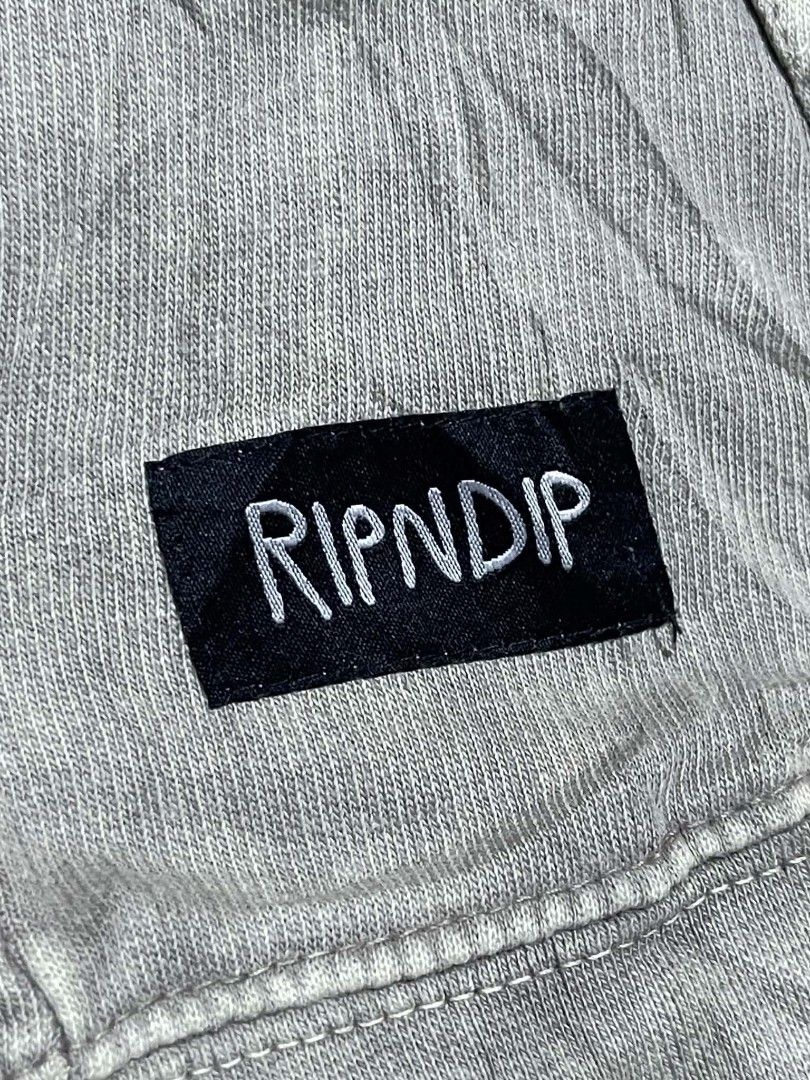 RIPNDIP Grey Cat Alien Graphic Hoodie (Category: Hoodies) located in Pangantucan. Submitted by calmwhale_cb83a8 (Listing ID 1461202736, Image 2). Description: - Grey RIPNDIP hoodie featuring a cat and alien graphic. -with minimal hairline crack - Crafted from 100% comfortable cotton. - Designed with a convenient front pocket and adjustable drawstring hood. - Proudly made in Pakistan. - Ideal for everyday casual wear..