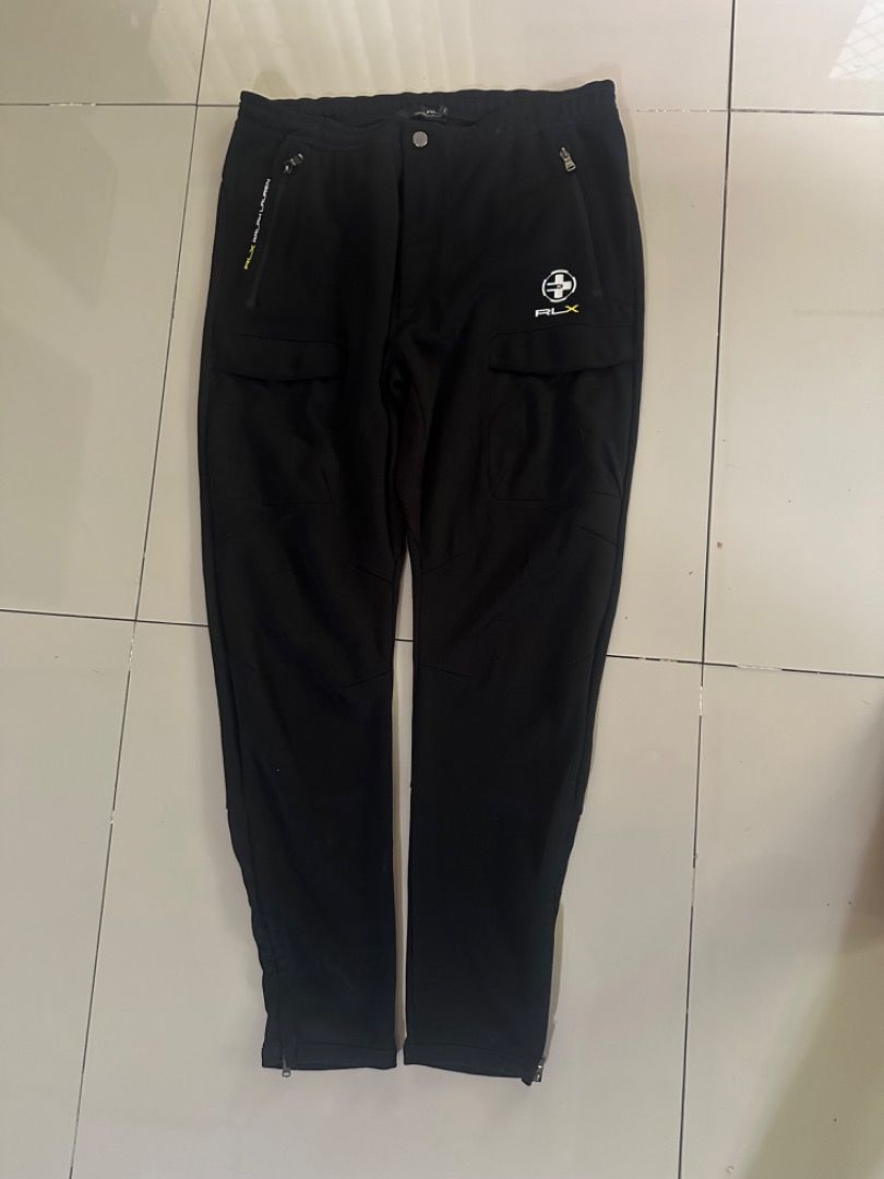 RLX Ralph Lauren Black Cargo Pants (Category: Jeans) located in Caloocan City. Submitted by ithrift2k24 (Listing ID 1461183645, Image 1). Description: - Brand: RLX Ralph Lauren - Color: Black - Style: Cargo Pants - Features: Zip pockets, button closure - Material: 91% Polyester, 9% Elastane - Trim: 100% Polyester - Ideal for: Outdoor activities, casual wear.