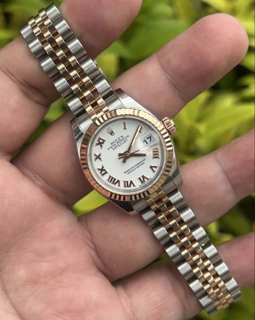 ROLEX Datejust (Category: Women's Watches) located in Manila. Submitted by timer_starts (Listing ID 1461239369, Image 2). Description: Ref: 179171 Size: 26mm Movement: Automatic Bezel: Rose gold fluted bezel Dial: White Roman Bracelet: Jubilee Rose Gold Inclusion: Complete set ( Box, Manual, Unit, tag and Card).
