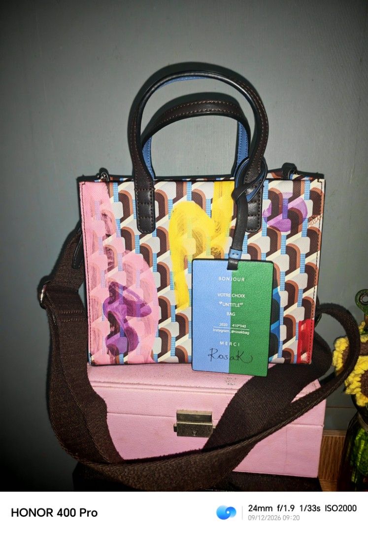 Rosa K. "Untitle" Bag (Category: Tote Bags) located in Manila. Submitted by cleverwhale_45b7bc (Listing ID 1461183181, Image 1). Description: - Cute tote bag from Rosa K. - Features the 'Untitle' design. - Top handles and a detachable shoulder strap. - Interior includes a zippered pocket and two slip pockets. - Ideal for everyday use. - Comes with original tags..