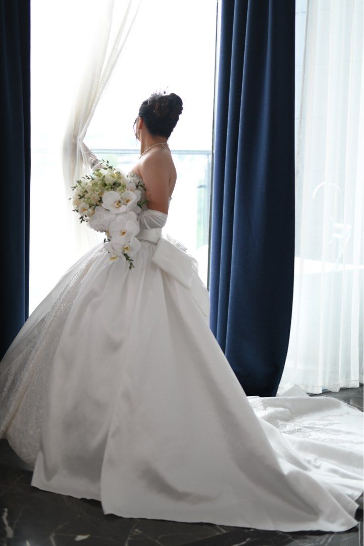 Royal Wedding Gown (Corset) (Category: Evening dresses & gowns) located in Manila. Submitted by vastearth-4b6e (Listing ID 1461130333, Image 3). Description: Selling my wedding gown for a cheaper price - Beautiful white wedding ball gown - Strapless bodice with intricate beading - Full skirt with a long train - Corset back - Removable bow at the back - 6 Hoop Petticoat included - Matching tiara and veil included - Gloves also included - Worn once