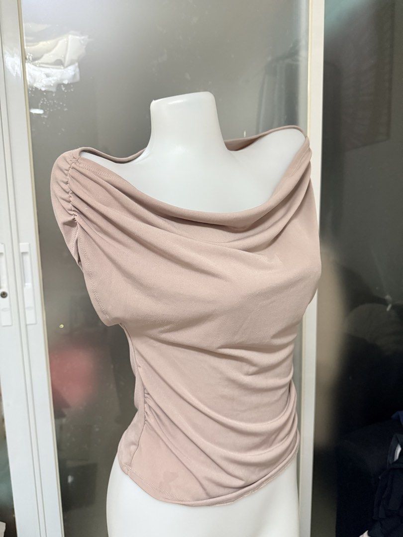 Ruched Off-Shoulder Drape Neck Top (Category: Blouses) located in Manila. Submitted by vienayala295618 (Listing ID 1461237227, Image 1). Description: - Super soft and stretchy fabric for ultimate comfort - Flattering ruched detail on the sides - Chic off-shoulder neckline - Elegant drape front design - Versatile: dress it up or down - Comfortable for all-day wear.