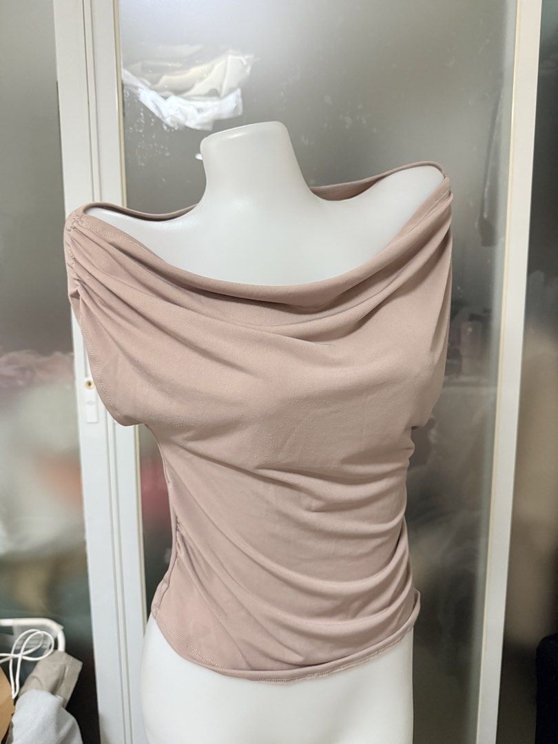Ruched Off-Shoulder Drape Neck Top (Category: Blouses) located in Manila. Submitted by vienayala295618 (Listing ID 1461237227, Image 2). Description: - Super soft and stretchy fabric for ultimate comfort - Flattering ruched detail on the sides - Chic off-shoulder neckline - Elegant drape front design - Versatile: dress it up or down - Comfortable for all-day wear.