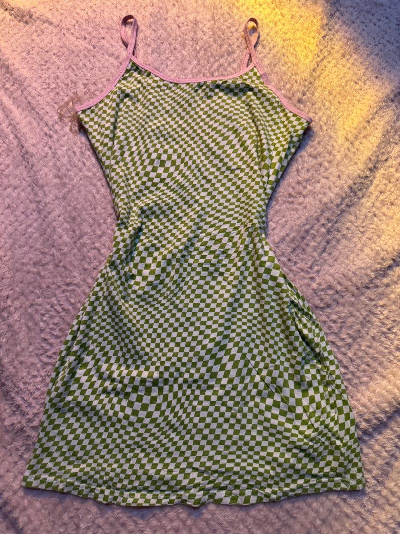 Rue 21 Green Checkered Mini Dress (Category: Dresses) located in Legazpi City. Submitted by satowa00 (Listing ID 1461270843, Image 1). Description: - Adorable green checkered mini dress from Rue 21 - Features charming pink trim on neckline and straps - Comfortable cotton and spandex blend - Versatile for casual day wear or evening fun - Easily pairs with sneakers or sandals for different looks.