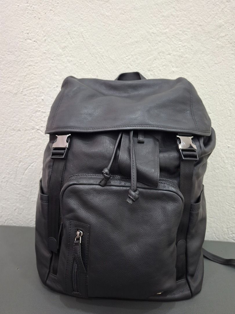 Sacoor Brothers Leather Backpack (Category: Backpacks) located in Baguio. Submitted by almostarriane (Listing ID 1461165966, Image 1). Description: - Sacoor Brothers black leather backpack - Made with 100% genuine leather - 100% polyester lining - Secure drawstring closure under flap with buckle straps - Features multiple internal pockets for organization - Ideal for everyday use or travel adventures.