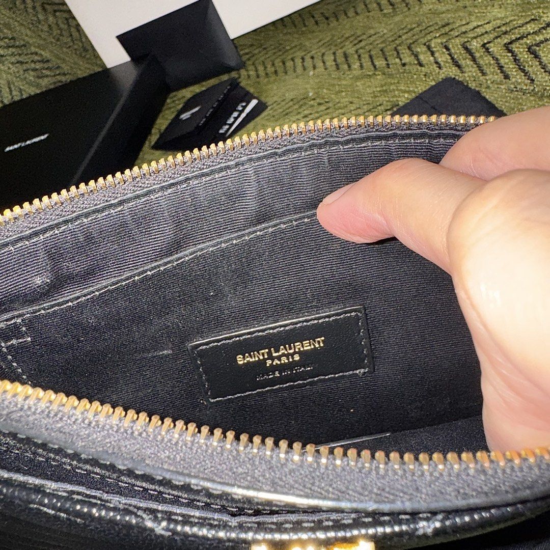 Saint Laurent Black Chevron Pouch Wristlet (Category: Luxury Bags & Wallets) located in Manila. Submitted by itschrisjuan (Listing ID 1461243471, Image 3). Description: - Authentic Saint Laurent Pouch - Color: Black - Iconic YSL logo - Chevron quilting - Detachable wrist strap - Interior card slots - Made in Italy - Includes dust bag, box, and shopping bag.