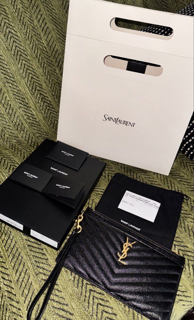 Saint Laurent Black Chevron Pouch Wristlet (Category: Luxury Bags & Wallets) located in Manila. Submitted by itschrisjuan (Listing ID 1461243471, Image 1). Description: - Authentic Saint Laurent Pouch - Color: Black - Iconic YSL logo - Chevron quilting - Detachable wrist strap - Interior card slots - Made in Italy - Includes dust bag, box, and shopping bag.