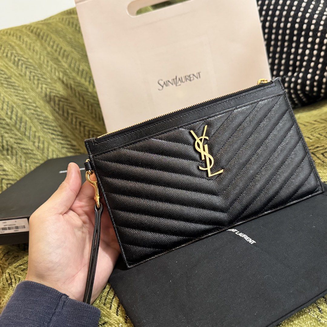 Saint Laurent Black Chevron Pouch Wristlet (Category: Luxury Bags & Wallets) located in Manila. Submitted by itschrisjuan (Listing ID 1461243471, Image 2). Description: - Authentic Saint Laurent Pouch - Color: Black - Iconic YSL logo - Chevron quilting - Detachable wrist strap - Interior card slots - Made in Italy - Includes dust bag, box, and shopping bag.