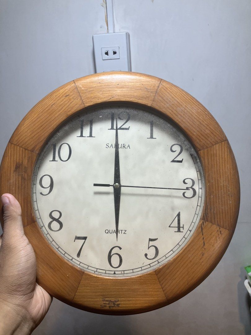 Sakura Quartz Wall Clock - Wooden Frame (Category: Clocks) located in Quezon City. Submitted by ponpin (Listing ID 1461154694, Image 1). Description: - Sakura Quartz Wall Clock - Elegant Wooden Frame - Classic Design with Clear, Easy-to-Read Numbers - Battery Operated - Versatile: Great for Any Room in the House - Fully Functional and Ready to Use - battery required.