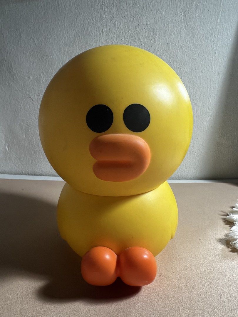 sally LINE FRIENDS (Category: Designer & Blind Box Toys) located in Valenzuela. Submitted by decluttering.manila (Listing ID 1461246082, Image 2). Description: Cute yellow duck toy. It's a container, you can store small items inside. The top part comes off. There's also a small plastic jar included. Great for organizing small trinkets or as a fun desk decoration. Bright yellow color..