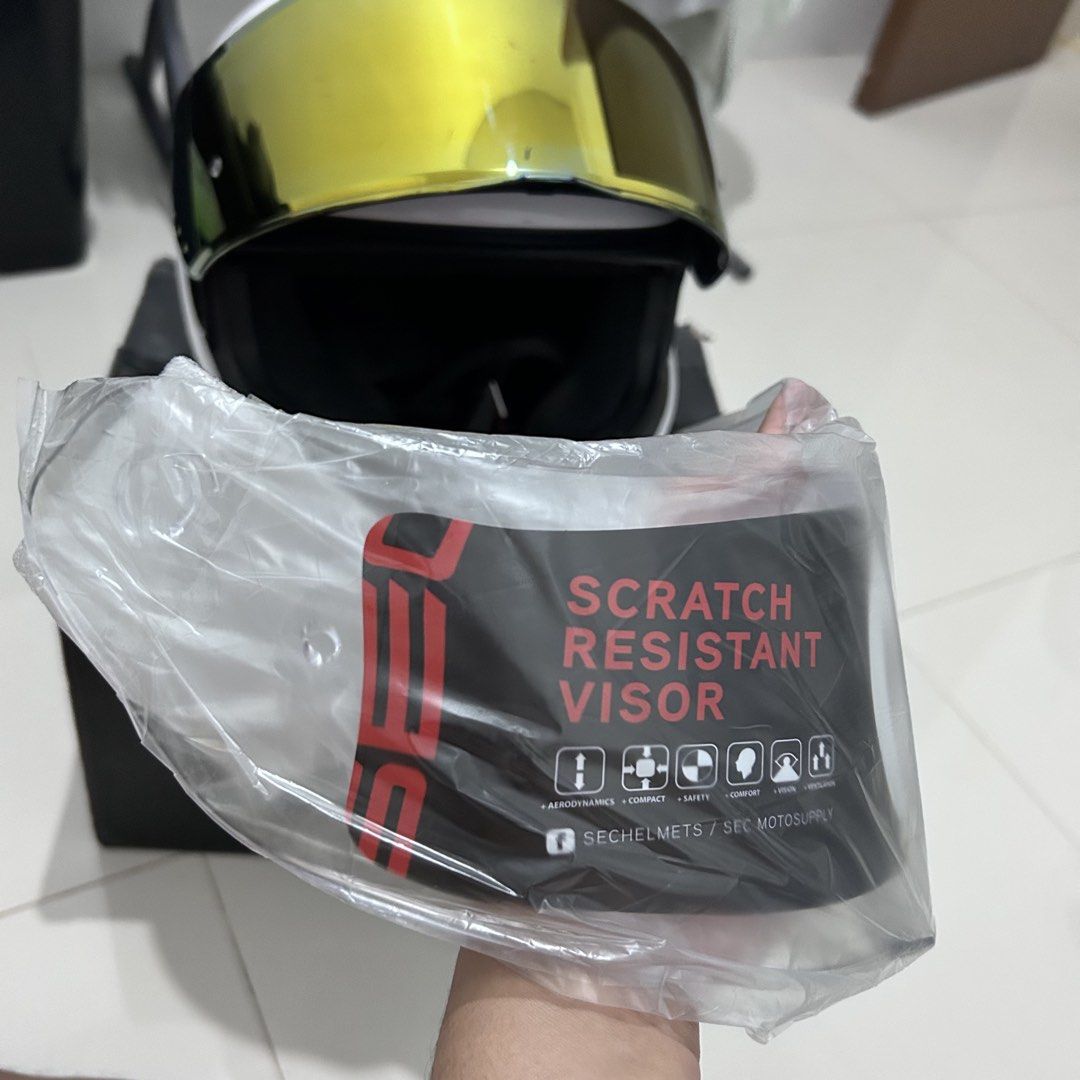 SEC Full Face Helmet with Gold Visor (Category: Helmets and other Riding Gears) located in Manila. Submitted by archivedbylevi (Listing ID 1461203362, Image 2). Description: - SEC Full Face Helmet - Only 2 months old - Used only a few times - Includes original box and dust bag - FREE transparent visor included - Selling because I have a spare helmet - Message for price and more details!.