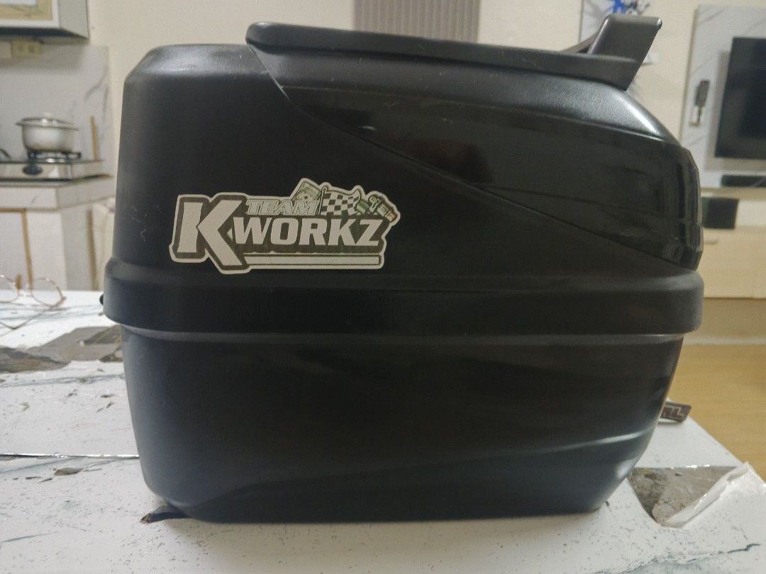 SEC Motorcycle Top Box with Keys (Category: Other Motorcycles Parts and Accessories) located in Manila. Submitted by annecbau (Listing ID 1461218215, Image 3). Description: SEC motorcycle top box with 'Na Thong' and 'K-Workz Team' stickers. Includes keys. Spacious for your essentials. Mounts on your motorcycle rack. Ideal for daily rides and longer trips. 36 liters.