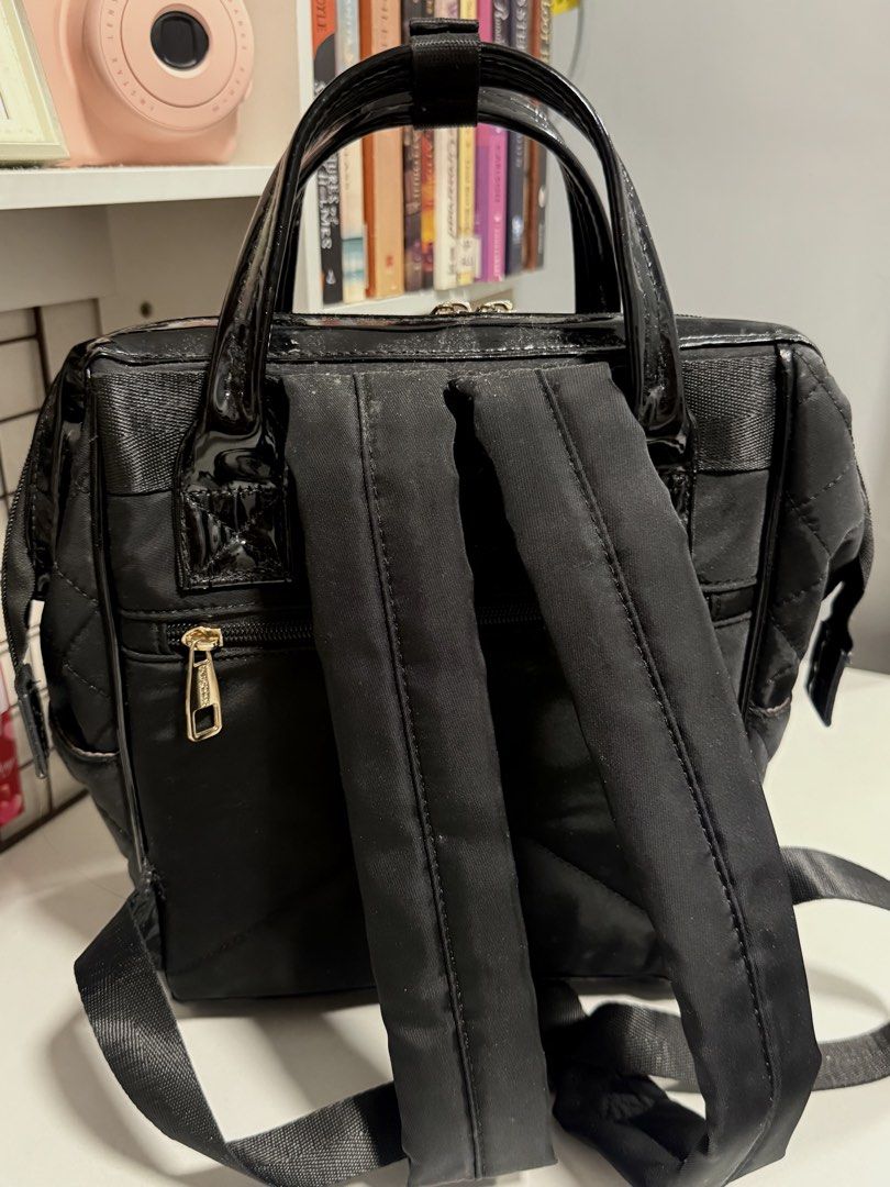 Secosana Black Backpack (Category: Backpacks) located in Cavite. Submitted by prelvds_ (Listing ID 1461275117, Image 3). Description: - Bought one year ago - No (visible) damage - Can fit up to 5 notebooks - Can fit 10.9 inch iPad - With side pockets.