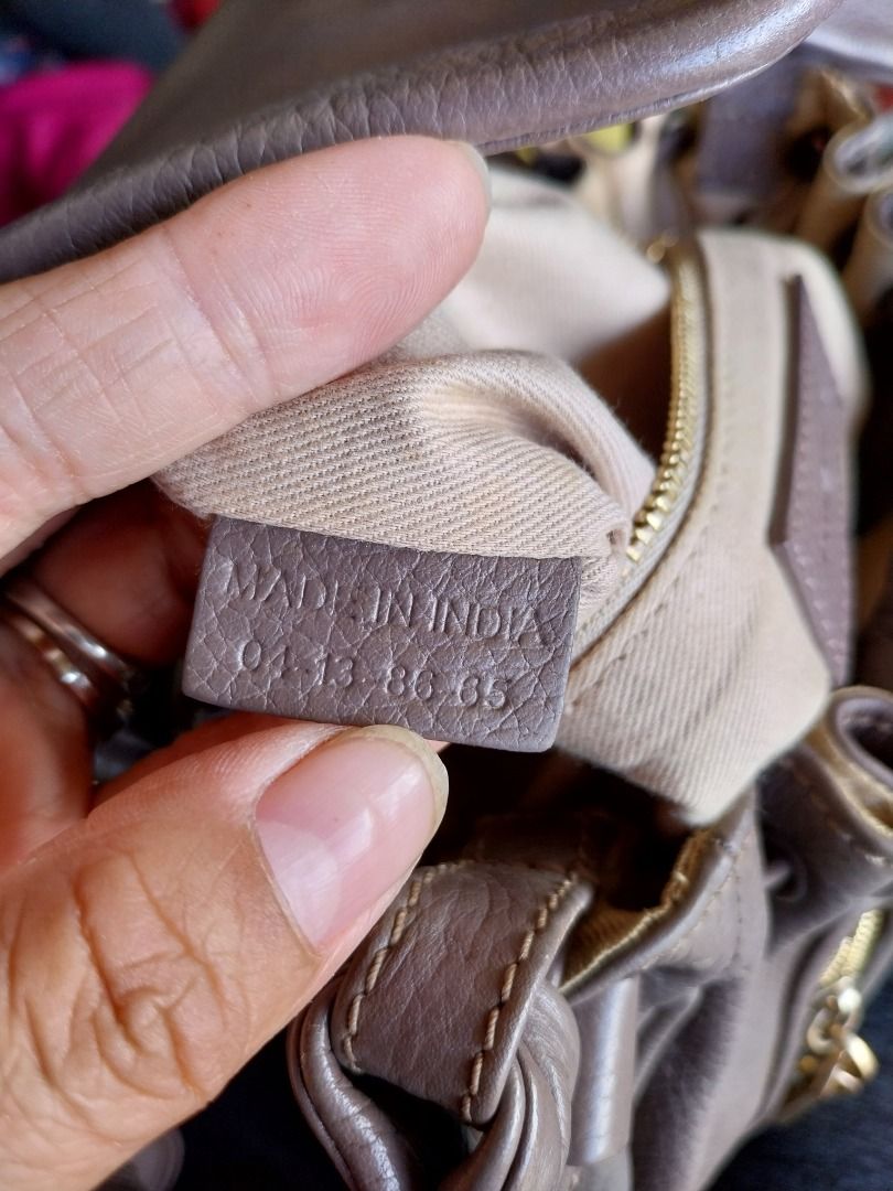 See By Chloe Leather Drawstring Shoulder Bag Taupe (Category: Luxury Bags & Wallets) located in Caloocan City. Submitted by gentleforest.e6775a (Listing ID 1461146494, Image 3). Description: - Brand: See By Chloe - Color: Taupe - Material: Leather - Style: Drawstring Shoulder Bag - Hardware: Gold tone - Features: Zipper details, tassel accent, top handle, detachable shoulder strap - Origin: Made in India.