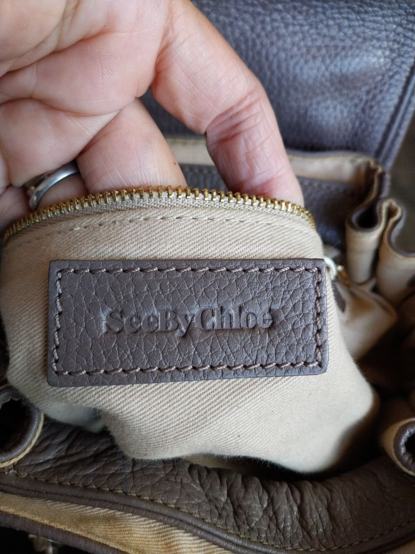 See By Chloe Leather Drawstring Shoulder Bag Taupe (Category: Luxury Bags & Wallets) located in Caloocan City. Submitted by gentleforest.e6775a (Listing ID 1461146494, Image 2). Description: - Brand: See By Chloe - Color: Taupe - Material: Leather - Style: Drawstring Shoulder Bag - Hardware: Gold tone - Features: Zipper details, tassel accent, top handle, detachable shoulder strap - Origin: Made in India.