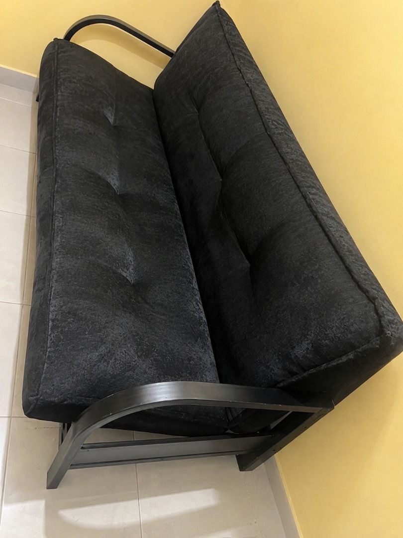 Selling Sofa Bed (Category: Sofas) located in Caloocan City. Submitted by viannskie (Listing ID 1461276103, Image 2). Description: Selling a black sofa bed in good condition. Comfortable and sturdy. Can be used as both a sofa and a bed. Buyer to shoulder delivery fee.