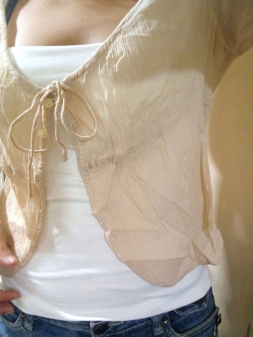 Sheer Beige Tie-Front Cardigan (Category: Blouses) located in Cabuyao City. Submitted by 4everblooms (Listing ID 1461188562, Image 1). Description: ♡ Beige/Apricot color ♡ Thin crepe-like fabric ♡ Ideal for layering over camisoles or tank tops mop: gcash only mod: jnt/ meet-up in nearby areas 🖇 dm me for more details.