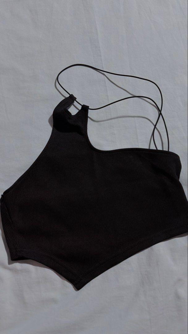 SHEIN Black One Shoulder Ribbed Crop Top (Category: Sleeveless) located in Iloilo. Submitted by kathiesboutique.ilo (Listing ID 1461321214, Image 1). Description: - SHEIN black one-shoulder crop top - Ribbed material - Thin spaghetti straps that cross at the back - Ideal for layering or wearing on its own - Versatile piece.
