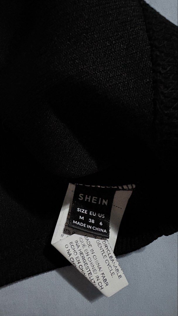 SHEIN Black One Shoulder Ribbed Crop Top (Category: Sleeveless) located in Iloilo. Submitted by kathiesboutique.ilo (Listing ID 1461321214, Image 2). Description: - SHEIN black one-shoulder crop top - Ribbed material - Thin spaghetti straps that cross at the back - Ideal for layering or wearing on its own - Versatile piece.