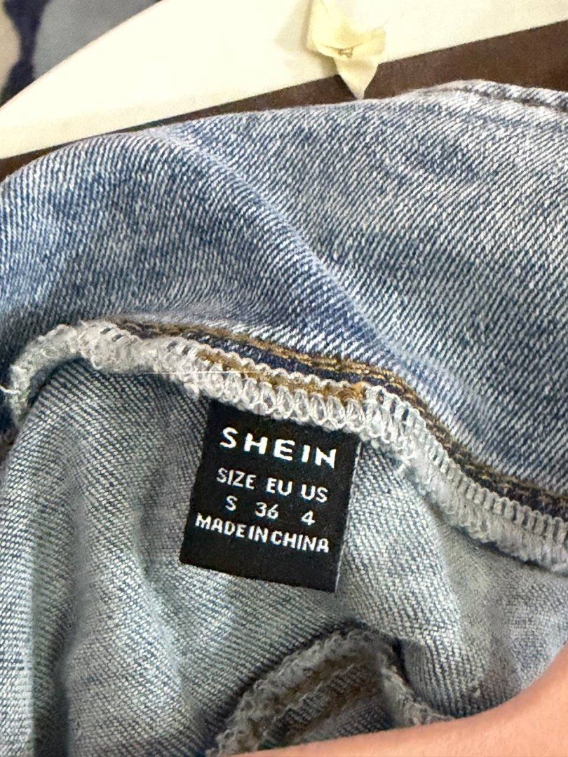 SHEIN Blue Denim Off-Shoulder Jacket Size S (Category: Coats, Jackets and Outerwear) located in Quezon City. Submitted by patzyy (Listing ID 1461279269, Image 3). Description: - SHEIN blue denim jacket - Off-shoulder style - Button-up front closure - Long sleeves with button cuffs - Versatile: pairs well with jeans or skirts - Ideal for casual outings.