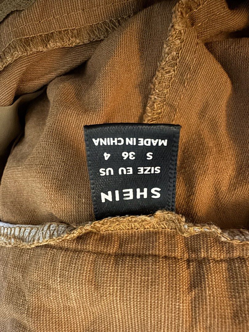 SHEIN Brown Pleated Wide Leg Pants (Category: Other Bottoms) located in Manila. Submitted by missalmon (Listing ID 1461257491, Image 3). Description: L: 36.5 inches W: 26 inches Double Button Linen Material Wide Leg No Issue.
