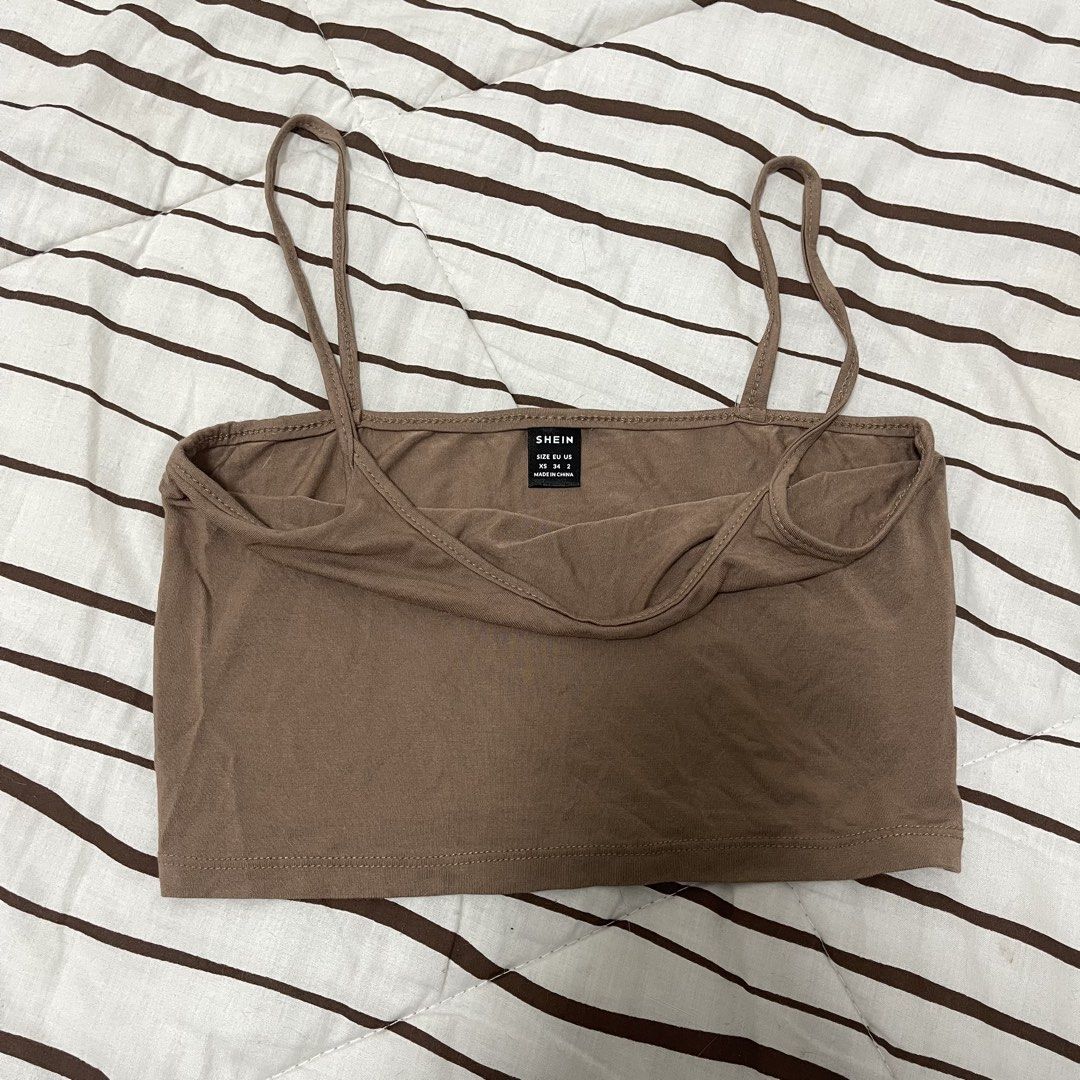 SHEIN Brown Spaghetti Strap Crop Top (Category: Sleeveless) located in Manila. Submitted by ukhy_shop (Listing ID 1461142063, Image 2). Description: - Brown Spaghetti strap crop top - Stretchy/material Cotton - Great fit: XS-S 🛒— ₱50 ONLY dm to avail !!.