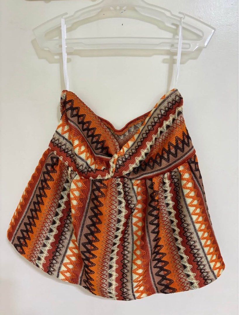 Shein Orange Tube Top (Category: Sleeveless) located in Calamba. Submitted by cdg02 (Listing ID 1461158385, Image 2). Description: - Fun zigzag print tube top - Twisted front detail - Stretchy material for comfort - Ideal for summer or beach vacations - Versatile: looks great with high-waisted shorts or skirts - Easy to wear and style Delivery fee c/o buyer.