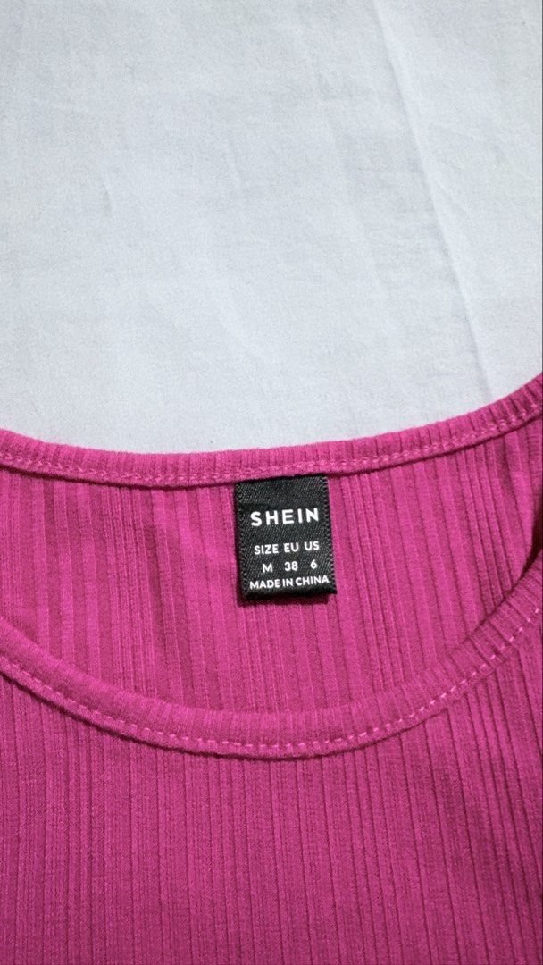 SHEIN Ribbed Tank Top - Pink (Category: Sleeveless) located in Iloilo. Submitted by kathiesboutique.ilo (Listing ID 1461321212, Image 2). Description: - Pink ribbed tank top from SHEIN - Racerback style - Comfortable and stretchy material - Perfect for layering or wearing solo - Easy to pair with any outfit.