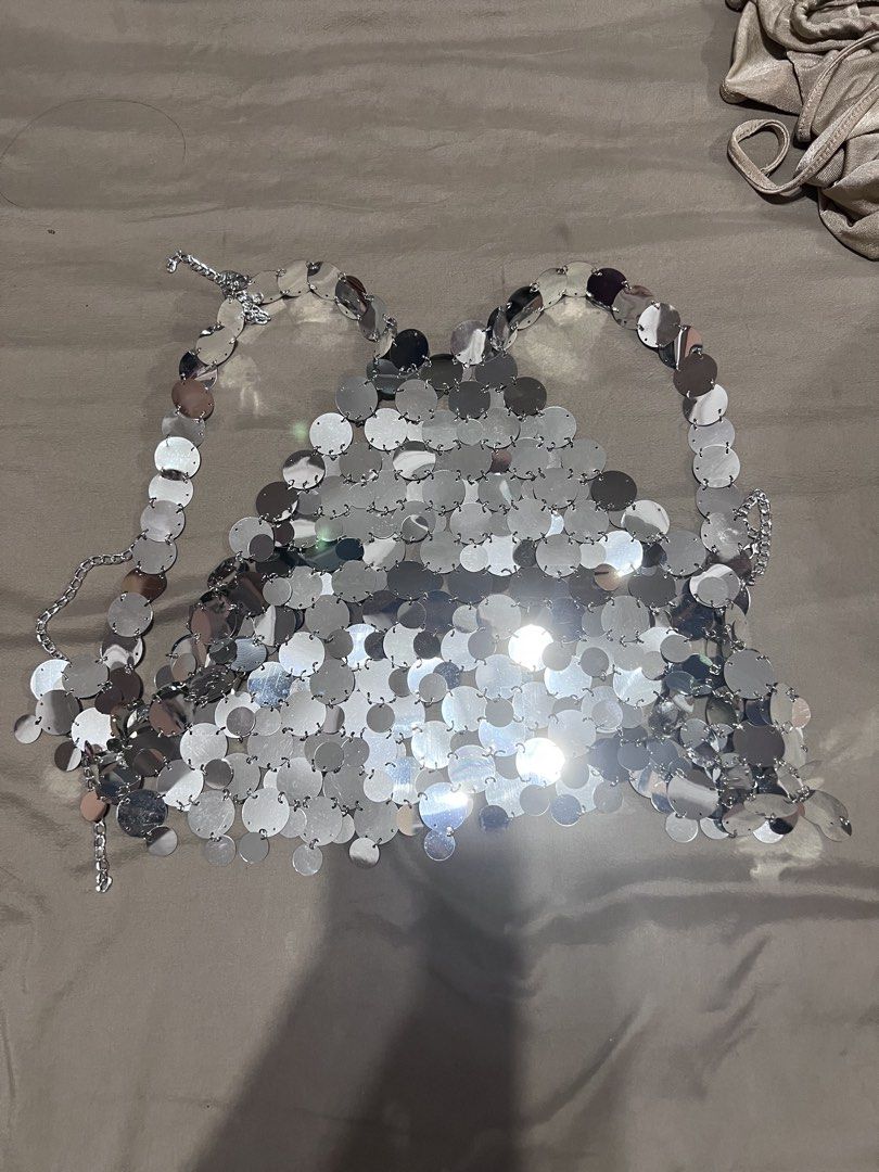 Silver Sequin Halter Top with Chain Detail (Category: Sleeveless) located in Quezon City. Submitted by jinnysells (Listing ID 1461276376, Image 1). Description: - Sparkly silver halter top - Covered in circular sequins - Chain detail at the back for closure - Ideal for parties or festivals - Unique, head-turning piece.