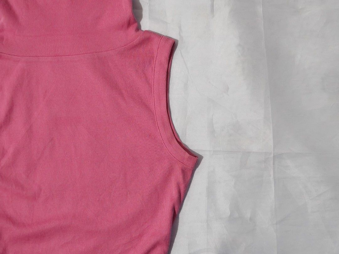 Sleeveless High-Neck Turtleneck Top (Category: Sleeveless) located in Pulilan. Submitted by hly_cllctn (Listing ID 1461197035, Image 2). Description: Sleeveless High-Neck Turtleneck Top ‎ ‎Small ‎ ‎Price: 95 (au) ‎ ‎Color: Hot Pink ‎​Style: High turtleneck, sleeveless, fitted silhouette ‎​Features: Soft stretch fabric, Korean side tag detail ‎​Condition: Good quality, no issue.