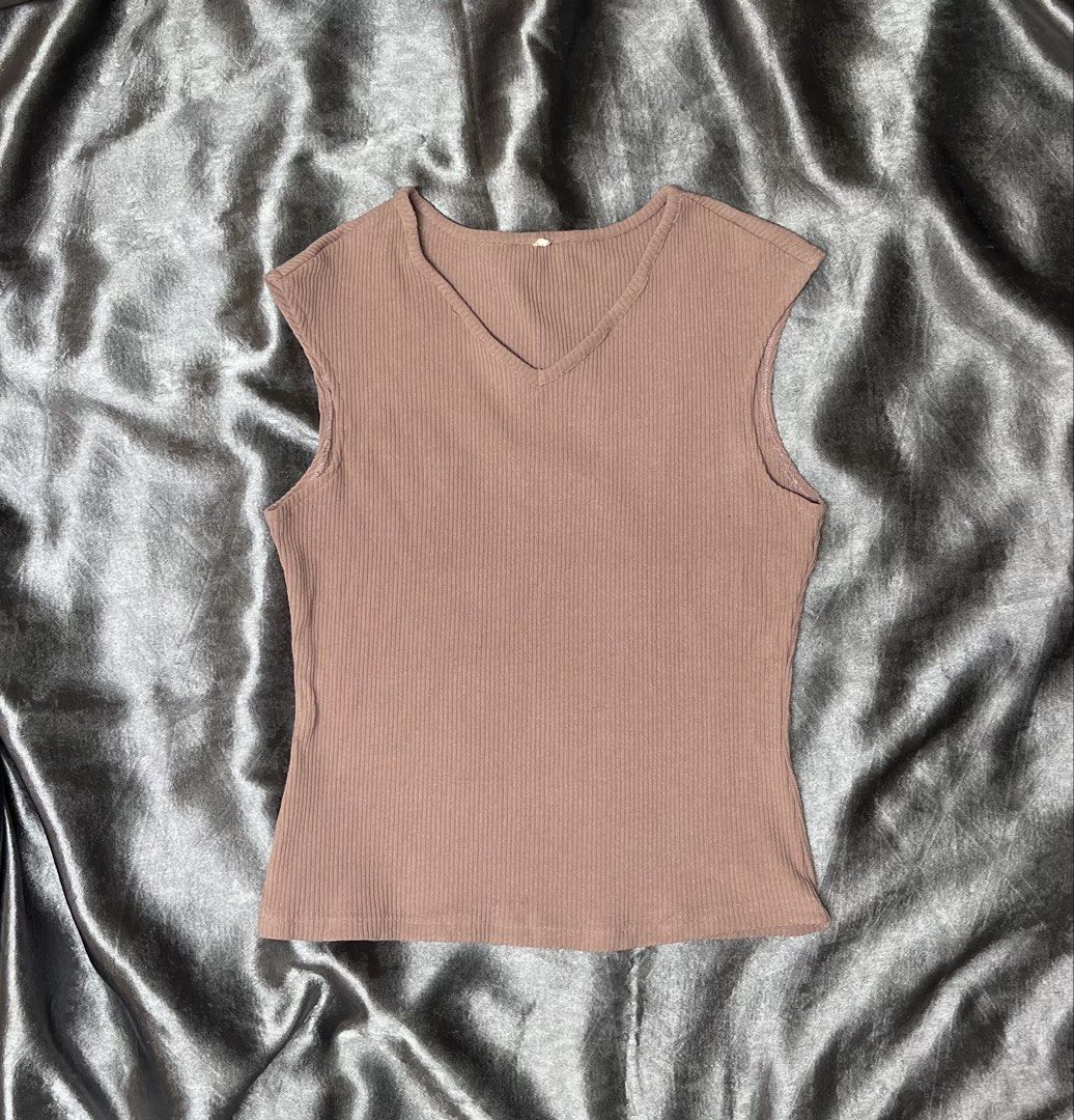 Sleeveless V-neck Ribbed Top (Category: Sleeveless) located in Cavite. Submitted by bellewii (Listing ID 1461046578, Image 1). Description: - Basic sleeveless top - Flattering V-neckline - Soft and stretchy ribbed knit fabric - Chic muted pinkish-brown color - Effortlessly stylish and comfortable for everyday wear.
