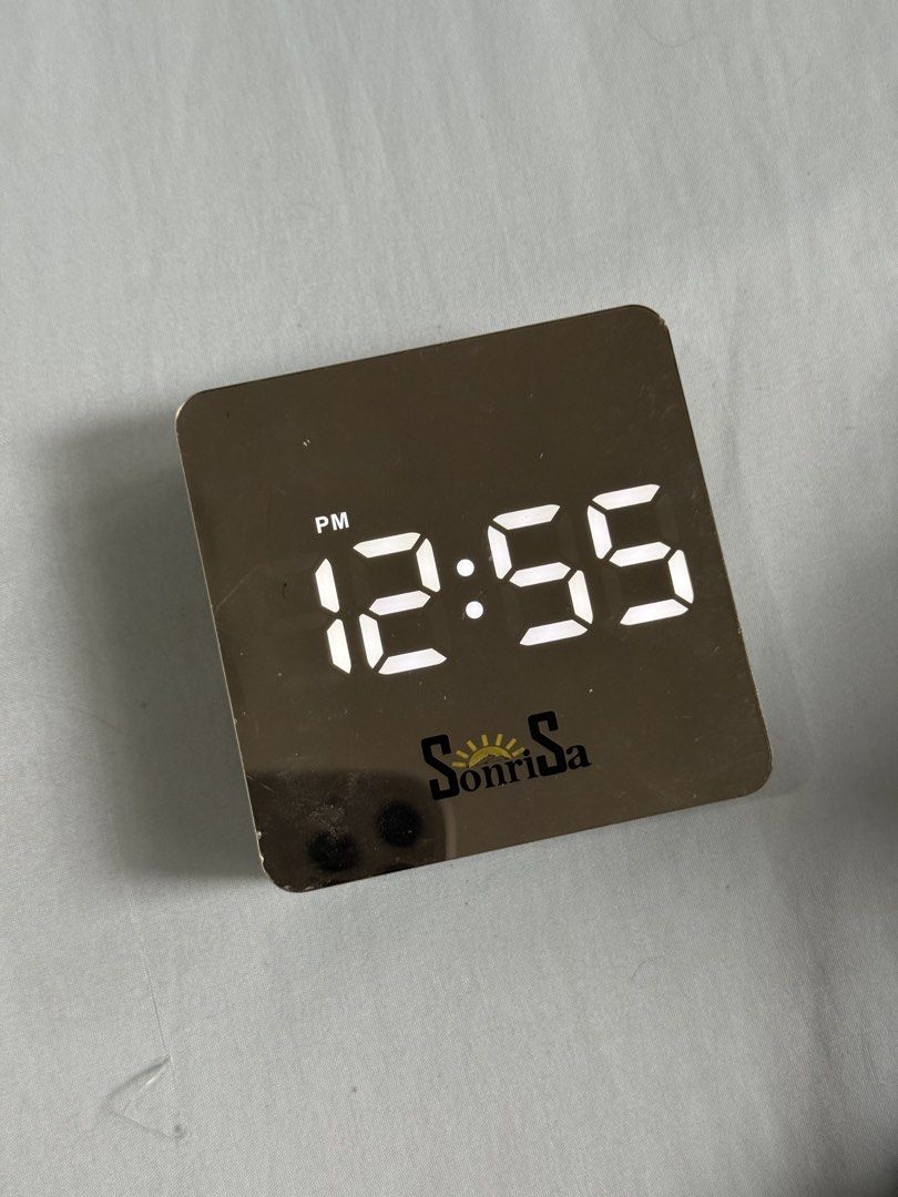 Sonrisa Digital Mirror Alarm Clock (Category: Clocks) located in Las Pinas. Submitted by cherrichigo (Listing ID 1461159563, Image 1). Description: - Sonrisa Digital Mirror Alarm Clock - Clear time display - Alarm and snooze functions - Built-in light - Powered by DC 5V or AAA batteries (no cord included) - Ideal for bedside tables Pick-up only Location: Las Piñas.