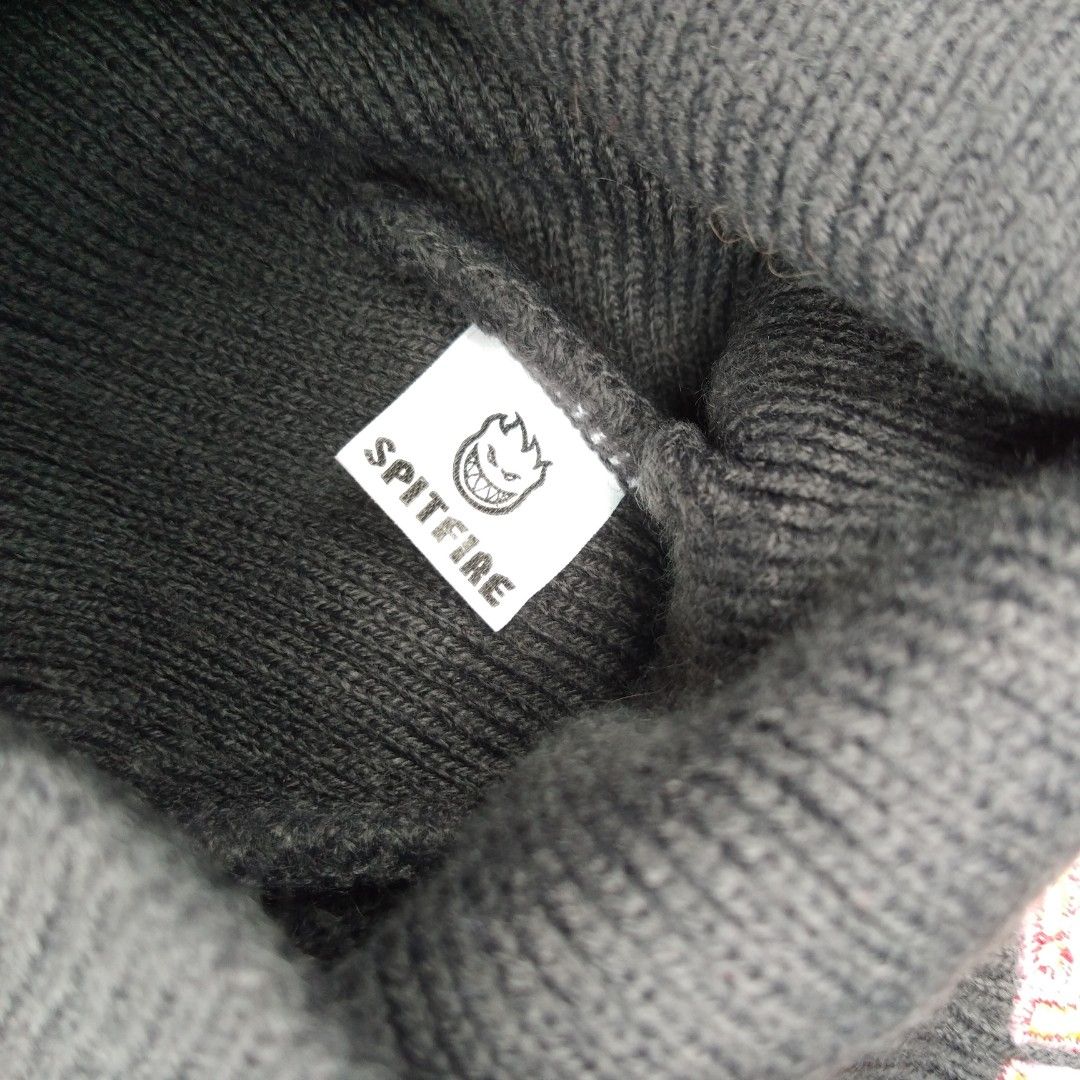 Spitfire Grey Beanie (Category: Caps & Hats) located in Tanza. Submitted by ThriftPieces (Listing ID 1461222926, Image 2). Description: - Grey knit beanie - Features embroidered Spitfire logo on the front - Spitfire logo also visible on the inside tag - Standard beanie size - Ideal for keeping warm.