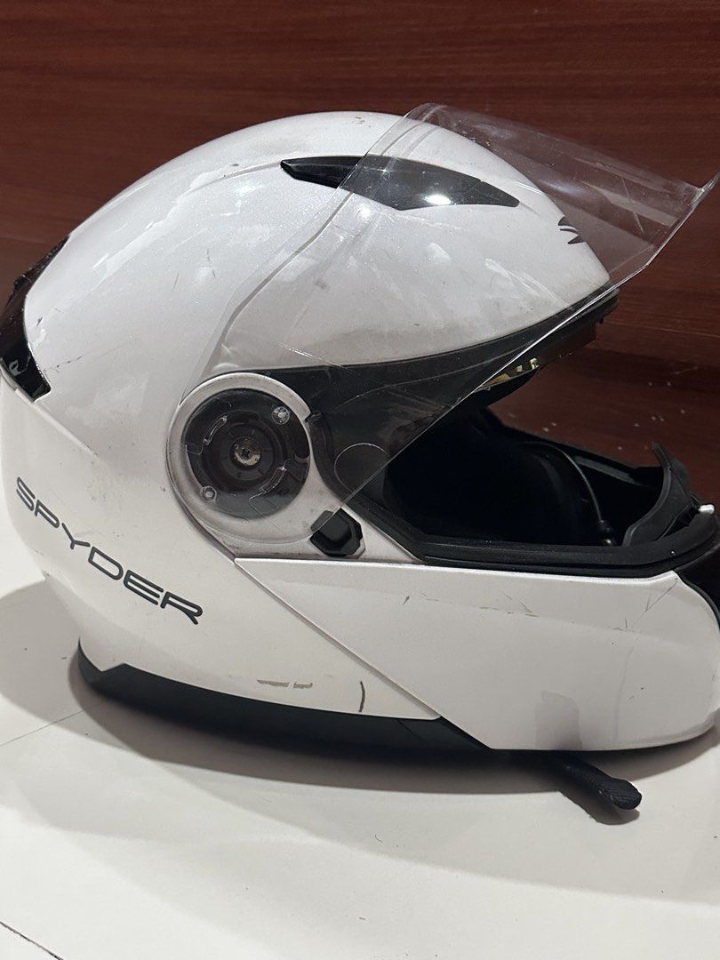 Spyder White Modular Motorcycle Helmet with Visor and Intercom (Category: Helmets and other Riding Gears) located in Calamba. Submitted by treb_c (Listing ID 1461318835, Image 2). Description: - White Spyder motorcycle helmet - Convenient flip-up/modular design - Minor scuffs and scratches on exterior - all need is just cleaning. Helmet - 1500 Parani M10 Motorcycle Bluetooth Intercom - 1500 Total: 3,000 Rfs: sold motorcycle. No need for the helme