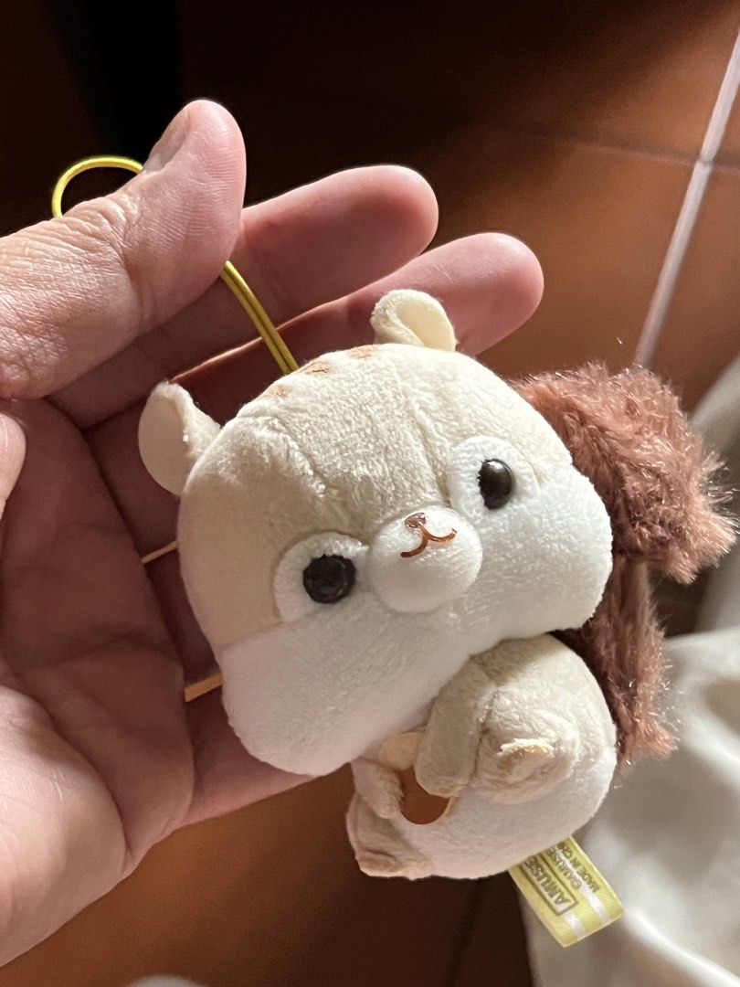 Squirrel light brown bag charm (Category: Luxury Accessories) located in Paranaque City. Submitted by bonsaiart (Listing ID 1461143443, Image 1). Description: Pre owned Good condition 275+sf Payment via GCASH or paymaya No to meetup No to cop / cod Shipping via j&t only No breaking of set or bundle.