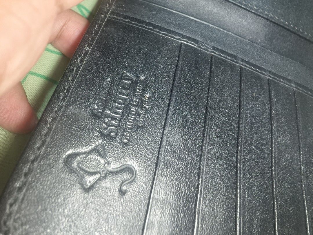 Stingray Leather Long Wallet Genuine Leather (Category: Wallets & Card holders) located in Sariaya. Submitted by queen_1213 (Listing ID 1461204240, Image 3). Description: - Unique black stingray leather exterior with a distinctive texture. - Spacious long wallet design for all your essentials. - Multiple card slots for organized storage. - Secure zippered compartment for coins or small items. - Genuine leather interior for a premium feel. - Easy 