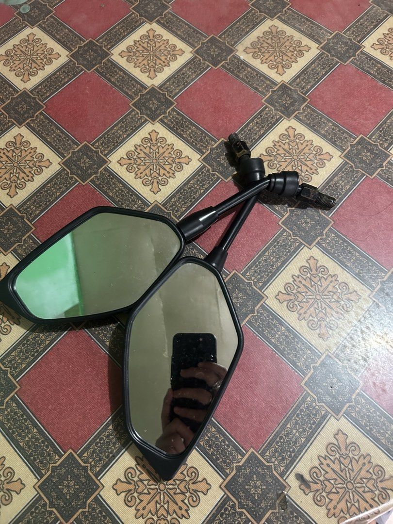 Stock Motorcycle Side Mirrors (Category: Mirrors) located in Manila. Submitted by ravereyes (Listing ID 1461191479, Image 3). Description: - Motorcycle Side Mirrors for Sale - Sleek Black Casing - Clear Reflective Surfaces - Adjustable Stems for Optimal Positioning - Universal Fitment - Compatible with most motorcycles - Upgrade your ride today!.