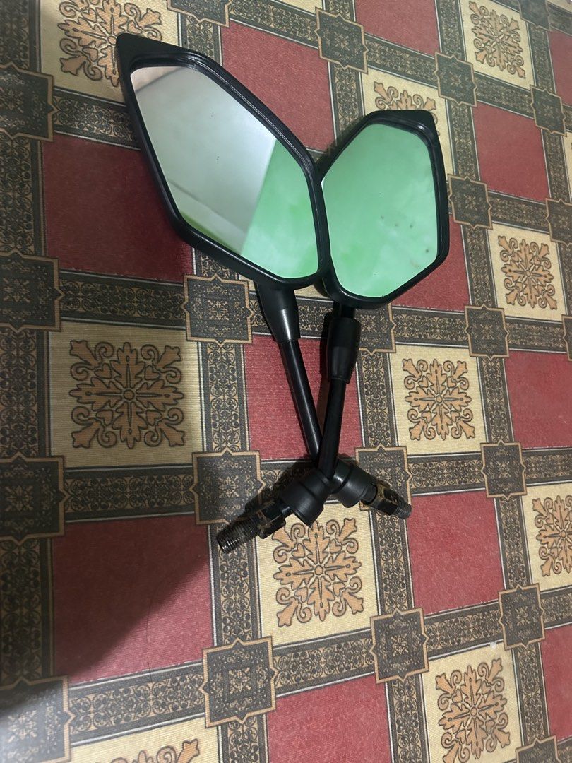 Stock Motorcycle Side Mirrors (Category: Mirrors) located in Manila. Submitted by ravereyes (Listing ID 1461191479, Image 2). Description: - Motorcycle Side Mirrors for Sale - Sleek Black Casing - Clear Reflective Surfaces - Adjustable Stems for Optimal Positioning - Universal Fitment - Compatible with most motorcycles - Upgrade your ride today!.
