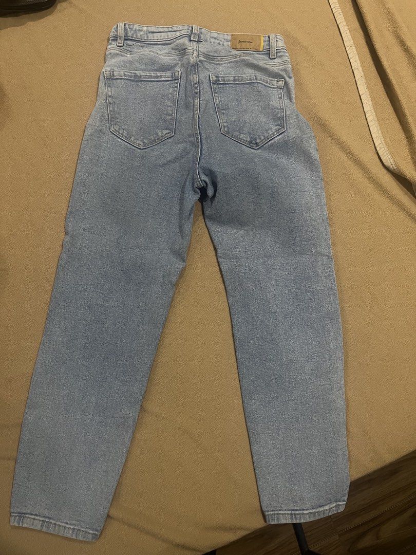 Stradivarius Mom Slim Light Blue Denim Jeans (Category: Jeans) located in Pasig City. Submitted by kakerts (Listing ID 1461277558, Image 3). Description: - Stradivarius Light Blue Mom Jeans - Slim Fit Style - Size: EUR 42 / US 10 / UK 14 - Made in Bangladesh - Classic Five-Pocket Design - Zipper and Button Closure - Perfect wardrobe staple.