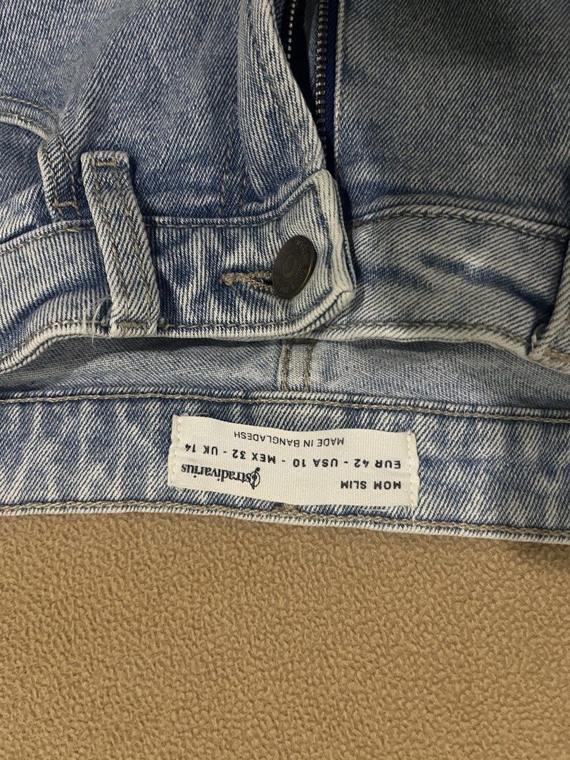 Stradivarius Mom Slim Light Blue Denim Jeans (Category: Jeans) located in Pasig City. Submitted by kakerts (Listing ID 1461277558, Image 2). Description: - Stradivarius Light Blue Mom Jeans - Slim Fit Style - Size: EUR 42 / US 10 / UK 14 - Made in Bangladesh - Classic Five-Pocket Design - Zipper and Button Closure - Perfect wardrobe staple.