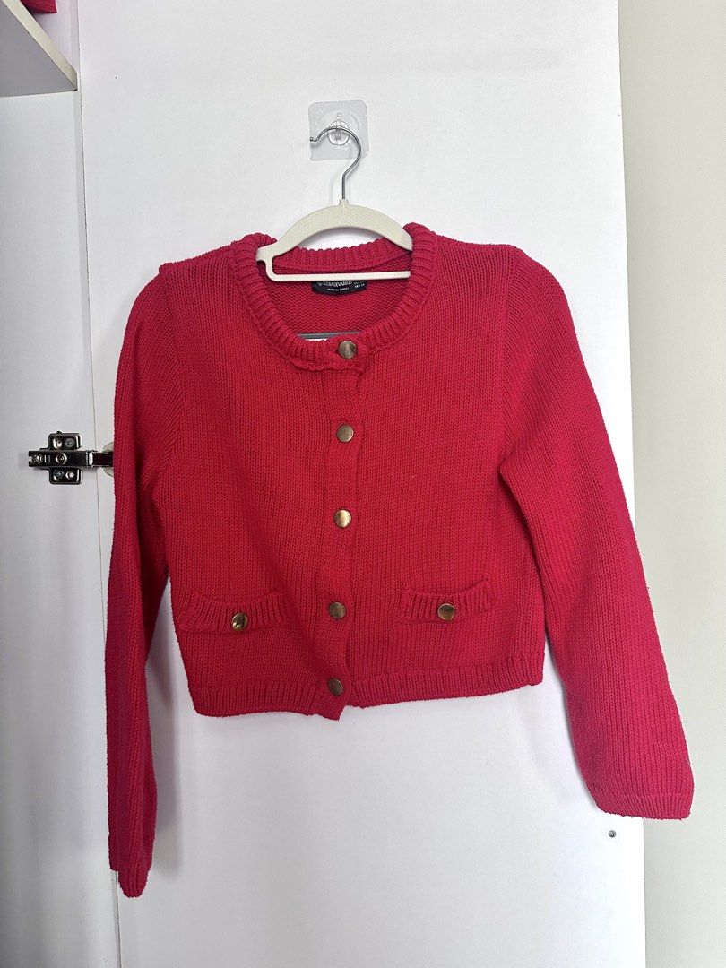Stradivarius Red Knit Button-Up Cardigan (Category: Coats, Jackets and Outerwear) located in Makati City. Submitted by lisette0324 (Listing ID 1461164963, Image 1). Description: - Red knit cardigan from Stradivarius - Gold-tone button-up front - Two small pocket details - Made in Turkey - Estimated size XS - Ideal for layering over tops or dresses.