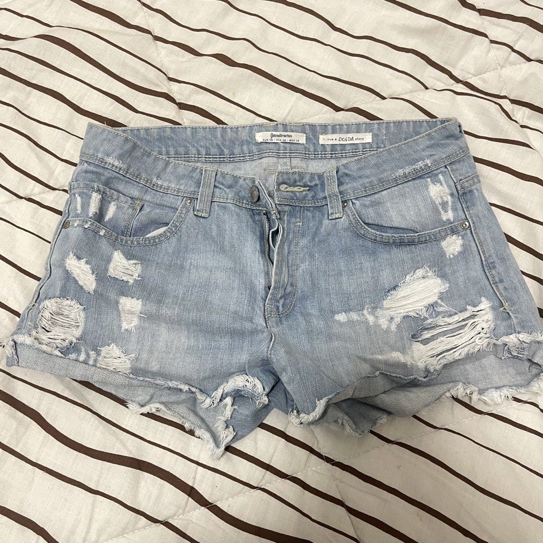 Stradivarius Ripped Denim Shorts (Category: Shorts) located in Manila. Submitted by ukhy_shop (Listing ID 1461285862, Image 1). Description: - Original pre-loved Stradivarius !! - Light wash denim shorts - Working button and zip closure - Great fit: M 🛒 — ₱150 ONLY dm to avail ‼️.