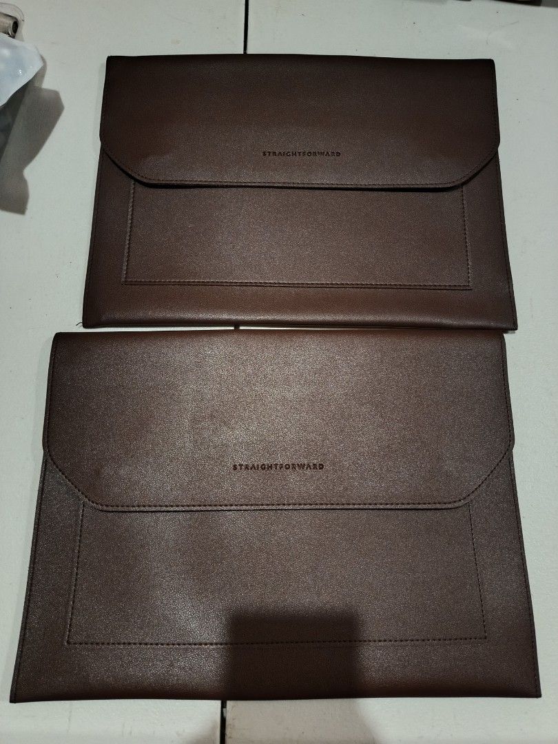 Straight forward Sleeve Case (Category: Laptop Bags & Sleeves) located in Cabanatuan. Submitted by glaemour01 (Listing ID 1461322790, Image 2). Description: - Set of two brown laptop sleeves - Minimalist design with embossed 'STRAIGHTFORWARD' logo - Faux leather material - Front zippered pocket for accessories - Secure magnetic snap closure - Soft fabric lining inside - Ideal for protecting laptops or tablets Bundle price no issue good as new.