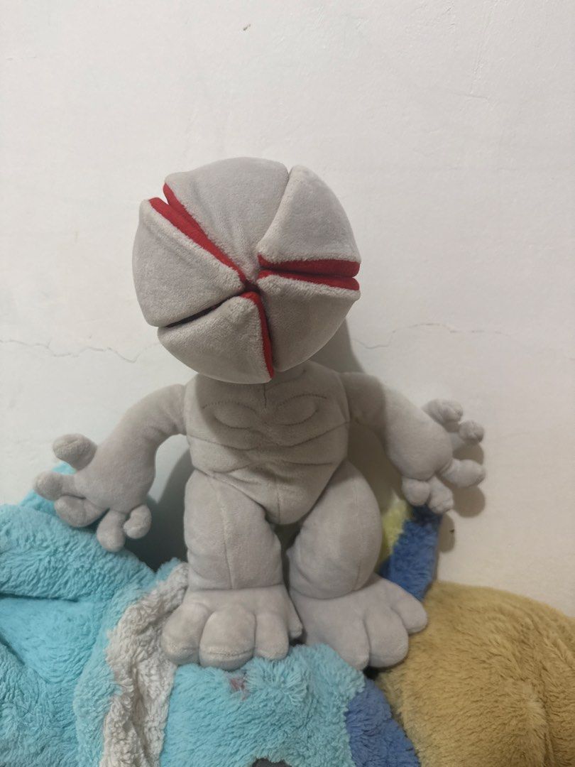 Stranger Things Demogorgon Plush Toy (Category: Plushies & Soft Toys) located in Bulacan. Submitted by khey (Listing ID 1461230884, Image 2). Description: - Iconic Demogorgon plush toy from Stranger Things - Features the signature opening flower-like head - Soft and huggable, perfect for fans of the show - Approximately 10 inches tall - Grey body with striking red accents.