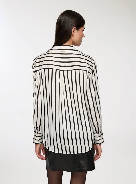 Striped Button-Up Blouse (Category: Blouses) located in Bacolod City. Submitted by bellabianca_closet (Listing ID 1461116203, Image 3). Description: 1st and 2nd pic not mine Never used, just removed tag & laundered - Classic black and white striped pattern - Button-up style - Long sleeves with button cuffs - Pointed collar - Relaxed fit - Versatile for work or casual occasions - Easy to style.