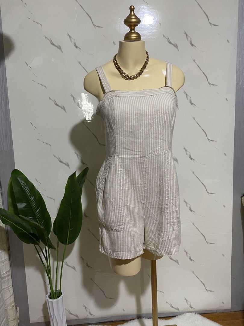 Striped Linen Blend Romper with Smocked Back (Category: Rompers) located in Taguig. Submitted by dinoswear.ph (Listing ID 1461205735, Image 1). Description: - Cute beige and white striped romper - Made from a comfortable linen blend fabric - Features a stylish square neckline - Adjustable straps for a perfect fit - Smocked back for extra comfort - Convenient pockets included - Versatile for casual outings or beach trips - Easy to pair with sandal