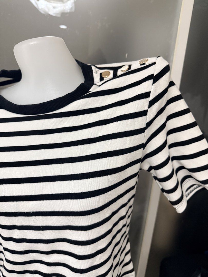 Striped Top with Button Detail (Category: Blouses) located in Manila. Submitted by vienayala295618 (Listing ID 1461235924, Image 2). Description: - Classic black and white striped top - Gold button details on the shoulder - Crew neck with black trim - Short sleeves - Great for casual wear.