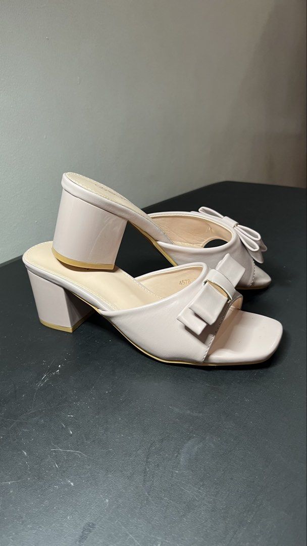 SUKI Pink Bow Block Heels Sandals (Category: Heels) located in Quezon City. Submitted by moms_closet_0306 (Listing ID 1461184332, Image 3). Description: - Brand: SUKI - Color: Pink - Style: Block Heels - Features: Cute bow detail on front strap, square toe, slip-on style - Heel Height: Approx. 2-3 inches - Occasion: Perfect for dressing up or casual wear Used only once (last March 2026 for a wedding).