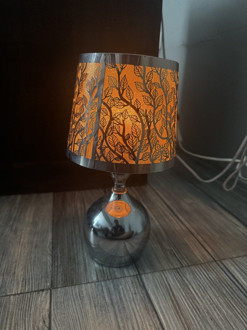 Table Lamp (touch lamp/ candle warmer) (Category: Lighting) located in Pasig City. Submitted by ponyo_ph (Listing ID 1461252396, Image 2). Description: - touch lamp w 3 light options - Features a decorative shade with a cut-out leaf pattern - Creates a beautiful, warm glow when lit - Ideal for bedside tables or as accent lighting - In good working condition.